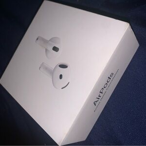 Apple White Earbud Headphones with Compact Design and Wireless Charging Case